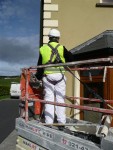 Health & safety good practice includes protective headwear and safety harness when working at heights. Total Paintworks Ltd., Ireland