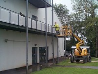Mobile elevated platform work by Total Paintworks Ltd., All employees follow best safety practices and hold a safe pass